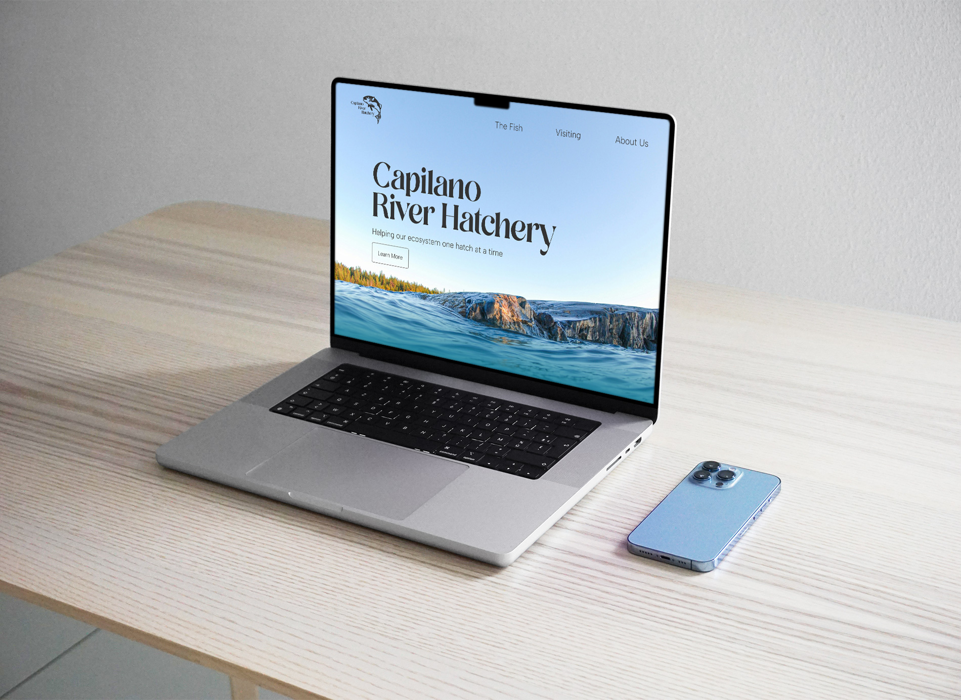 Laptop mockup displaying the homepage for the Capilano River Hatchery website redesign.