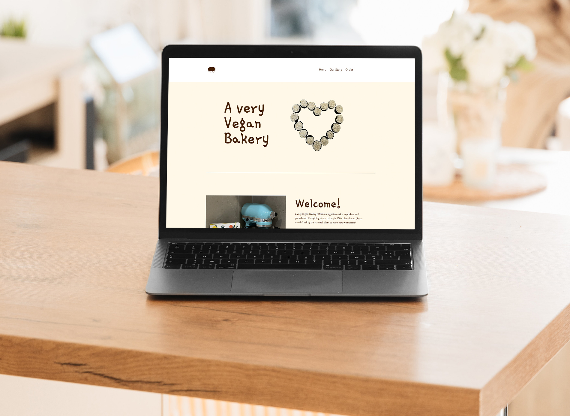 Laptop mockup displaying the homepage for A Very Vegan Bakery website.